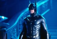 Batman in a ridiculous suit with overly defined muscles, bright colors, and nipple accents (Image via Warner Bros)